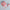 Pink washi tape with decorative design on a light gray background