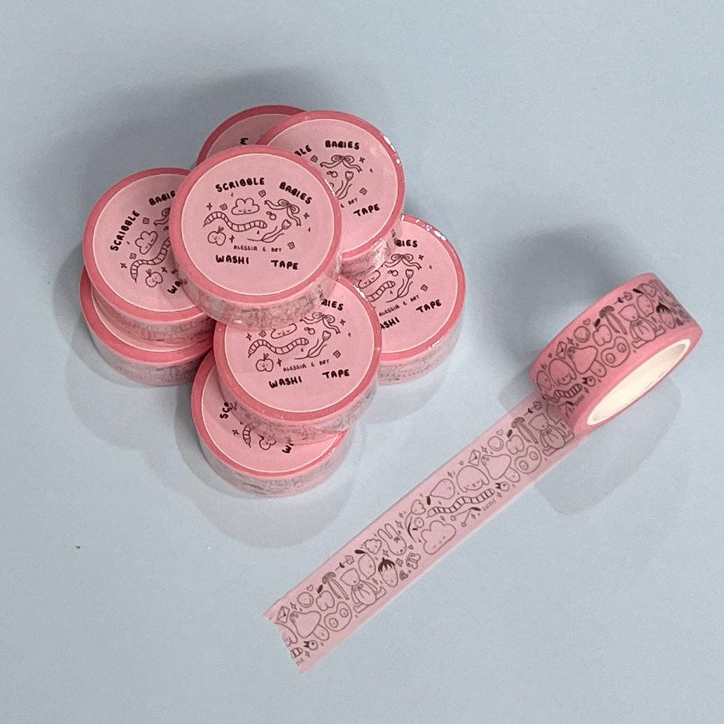 Pink washi tape with decorative design on a light gray background