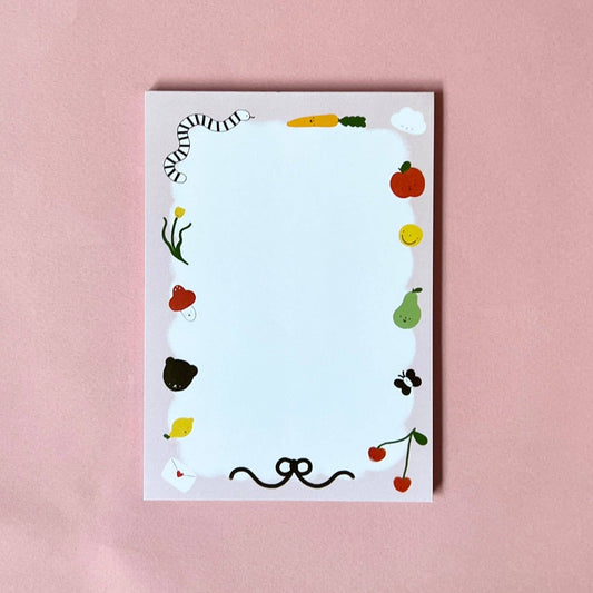 Notebook with colorful stickers on a pink background