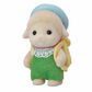 Small toy figure of a character wearing a green dress, yellow top, and blue hat on a white background