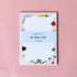Memo pad with cute illustrations on a pink background