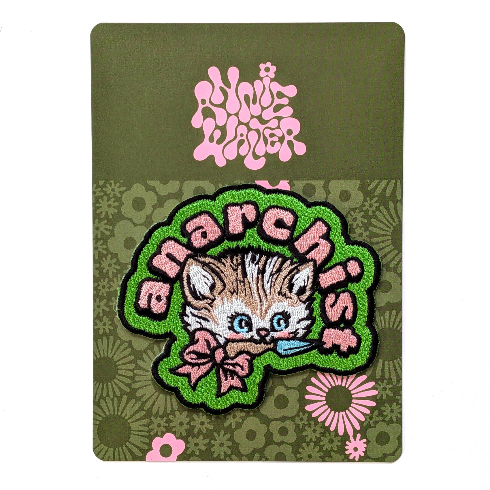 Patch with a cat design and 'anarchist' text on a green background with floral patterns.