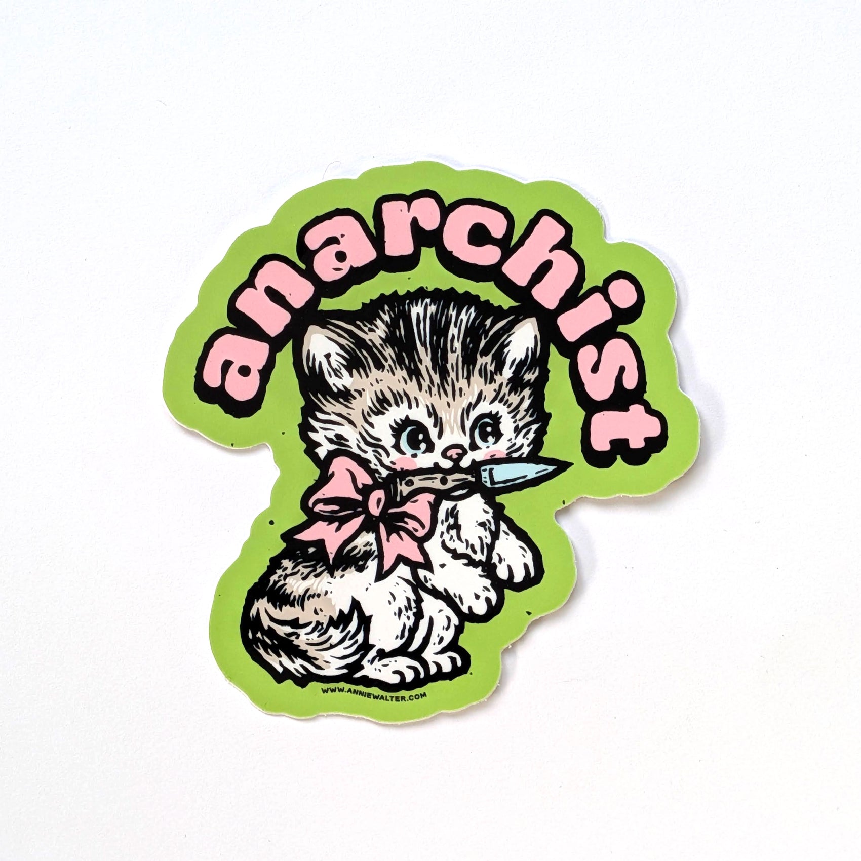 Green sticker of a cat design with the text 'anarchist' on a white background