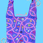 Reusable bag with colorful patterns and text on a blue background
