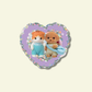 Two small sylvanian characters on a heart-shaped purple background with colorful border