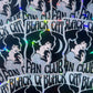 Stickers with a woman's silhouette and 'Black Cat Fan Club' text on a reflective surface.