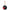 Black Pingu round keychain with a red nose and white eyes on a white background