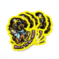 Stack of yellow stickers of a dog and the text 'Born to be mild'