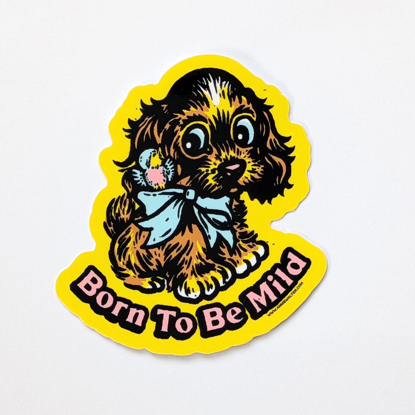 Yellow sticker of a dog with the text 'Born to be Mild'