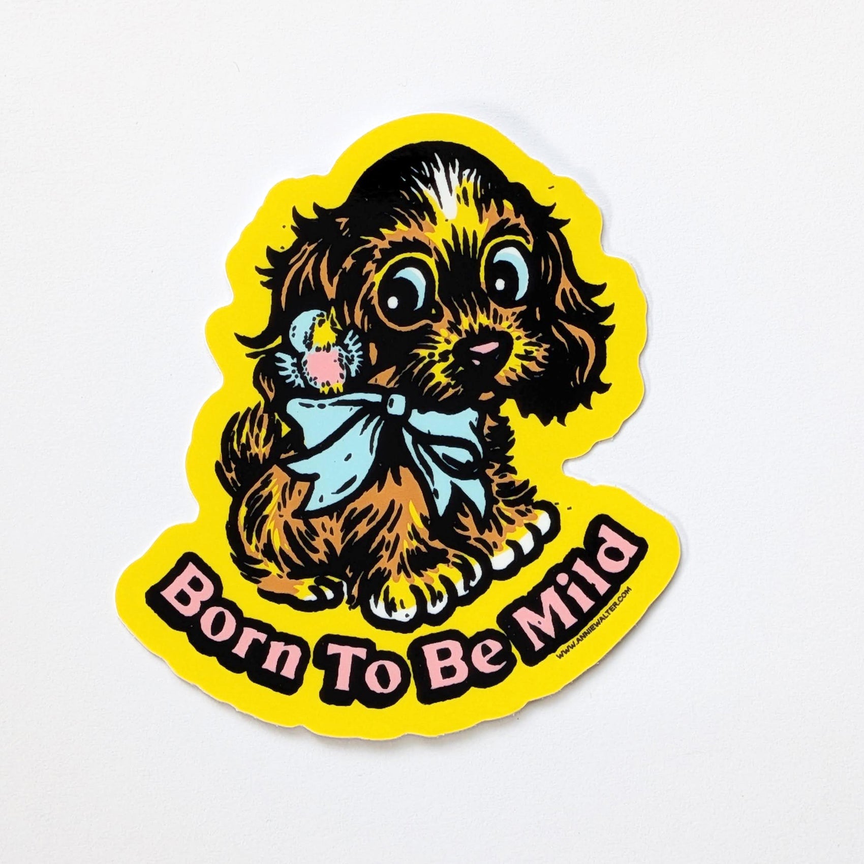 Yellow sticker of a dog with the text 'Born to be Mild'