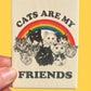 Magnet with cats and rainbow design on a yellow background