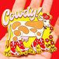 Cowdy! Magnet with a cow design on a red background