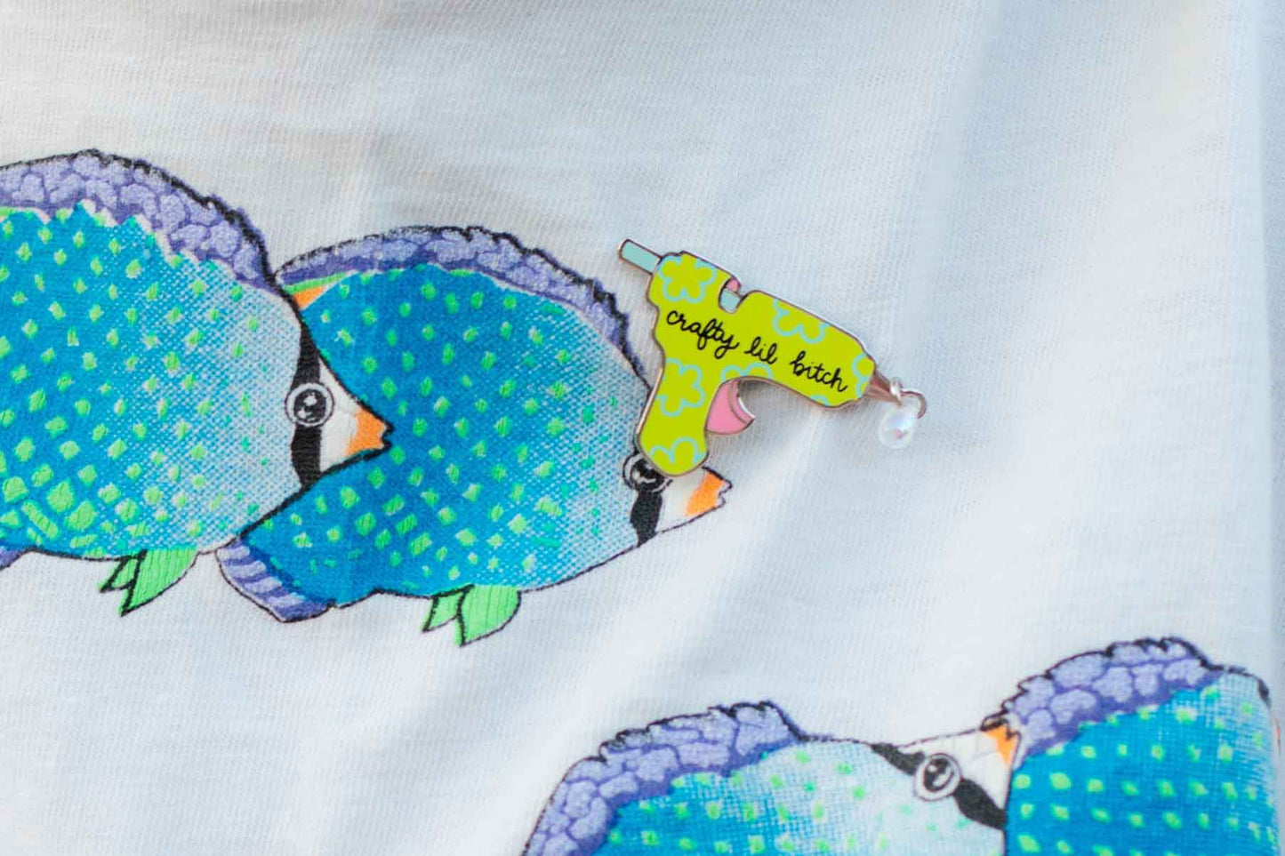 Colorful glue gun pin on a white background
