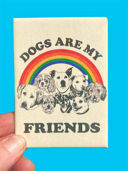 Magnet with 'Dogs are my friends' text and rainbow design on a blue background