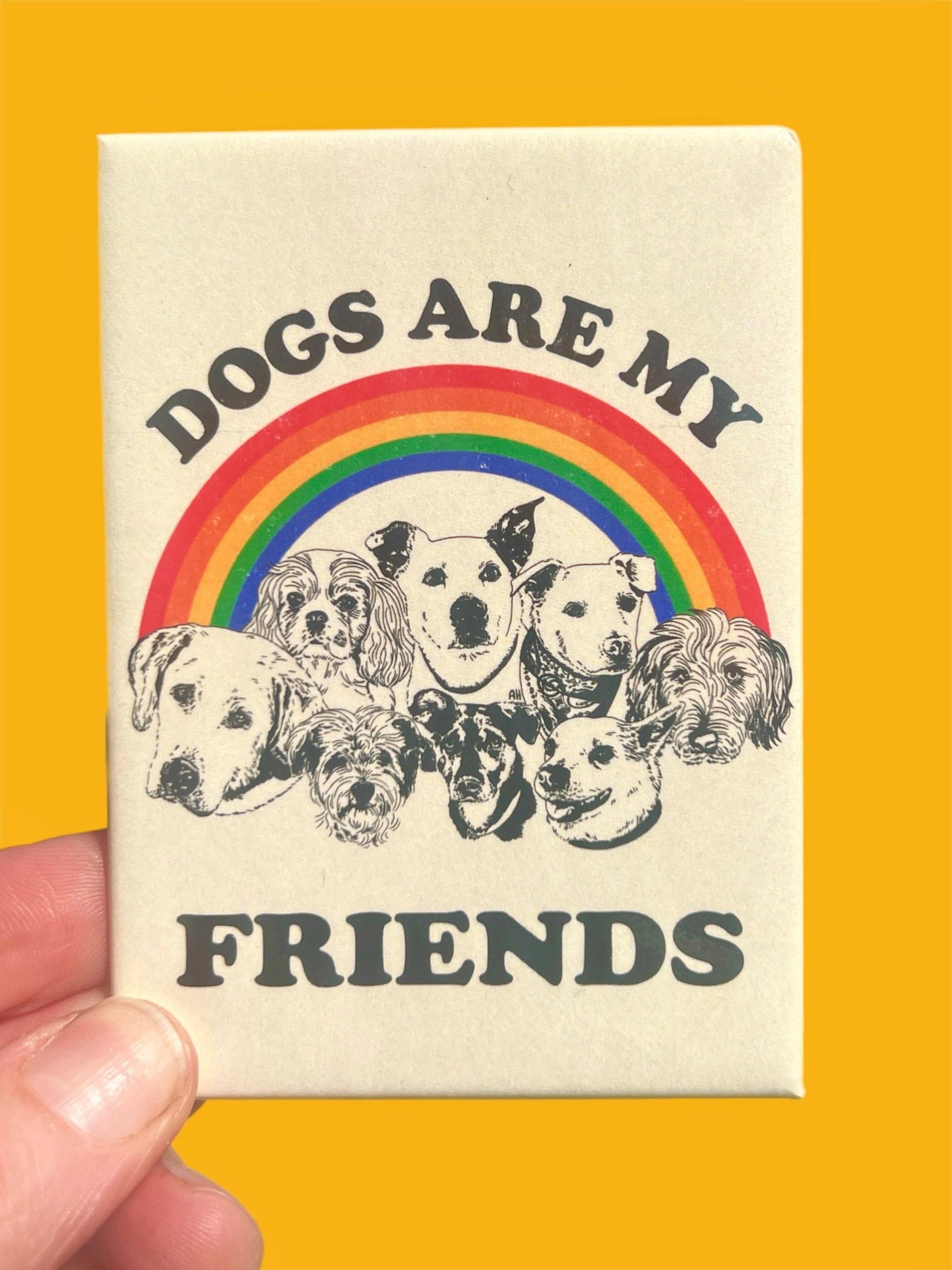 Magnet with 'Dogs are my friends' text and rainbow design on a yellow background
