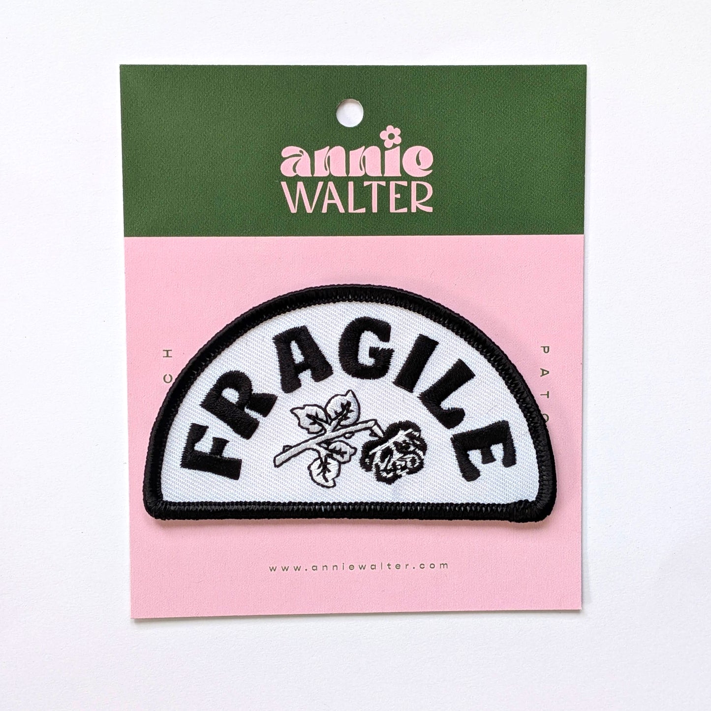 Patch with 'FRAGILE' text on a pink card with green top, featuring 'annie walter' branding.