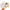 Hand holding a glittery furby sticker with a white background