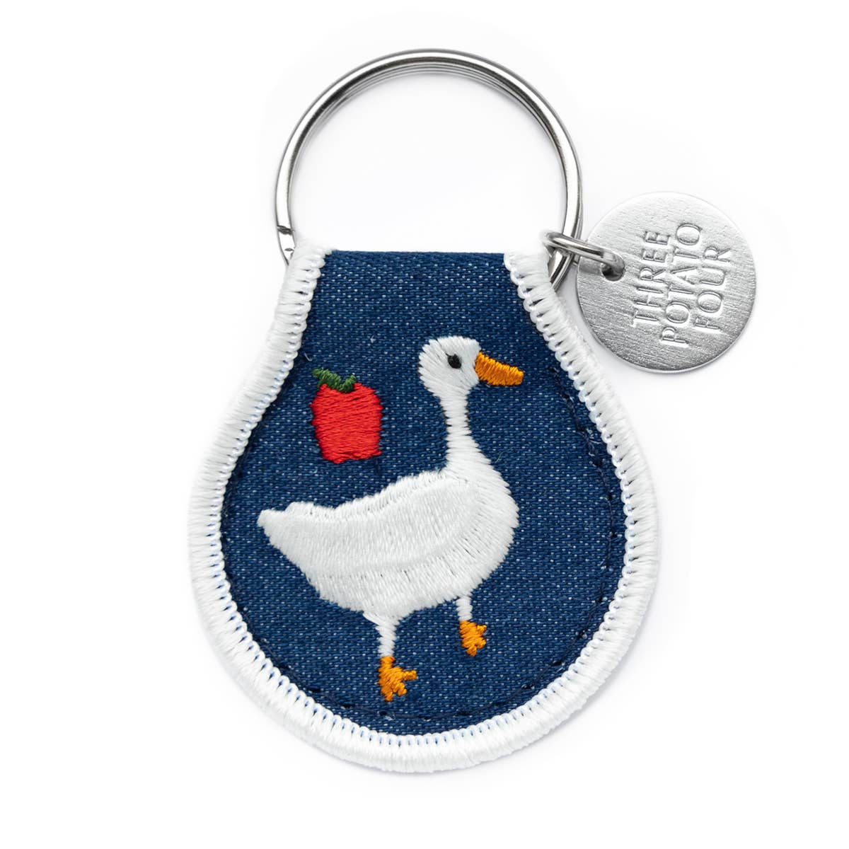 Keychain with a goose design on a blue background, featuring the brand 'Three potato four'.
