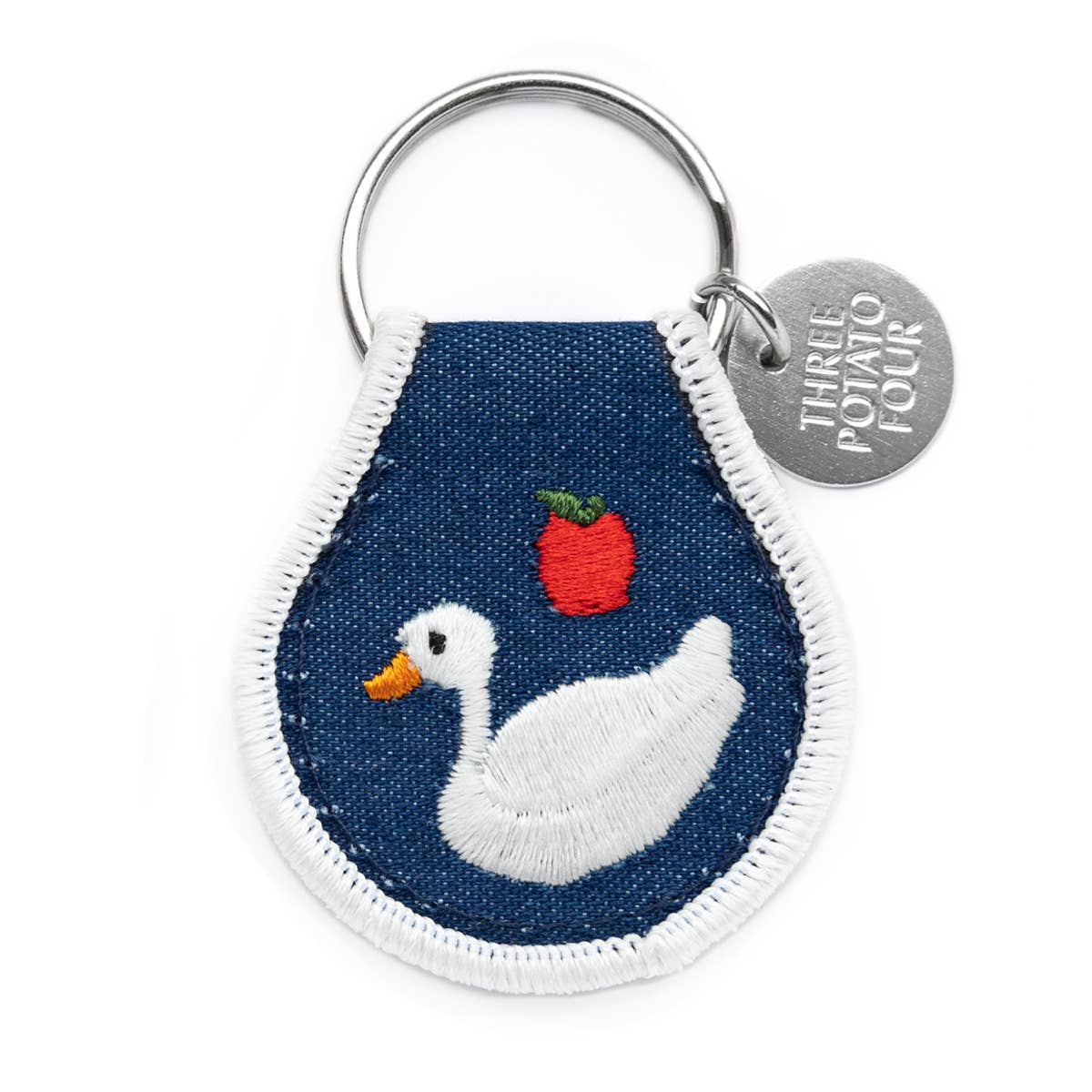 Keychain with a duck design on a blue background, featuring the brand 'Three Potato Four'.