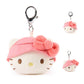 Plush keychain of a hello kitty character with a pink hat on a white background