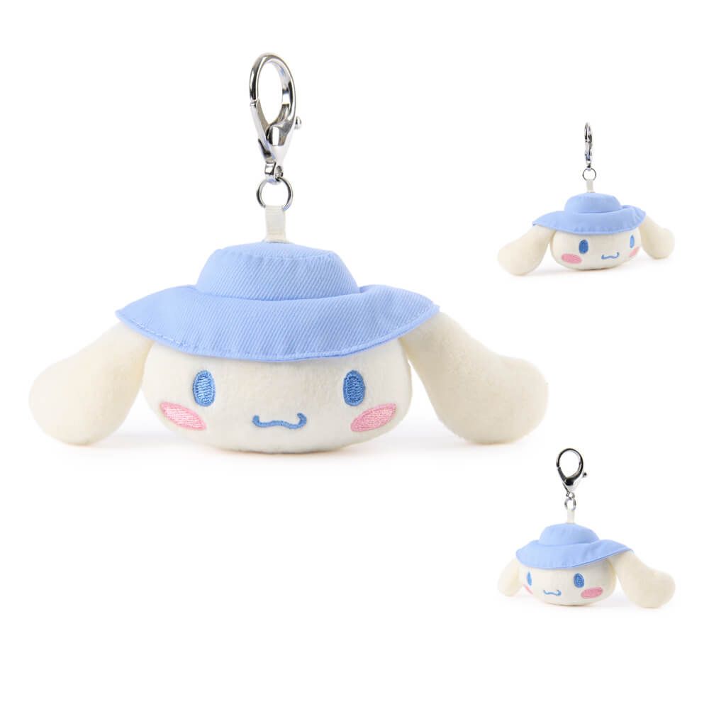 Plush keychain of cinnamoroll wearing a blue hat on a white background