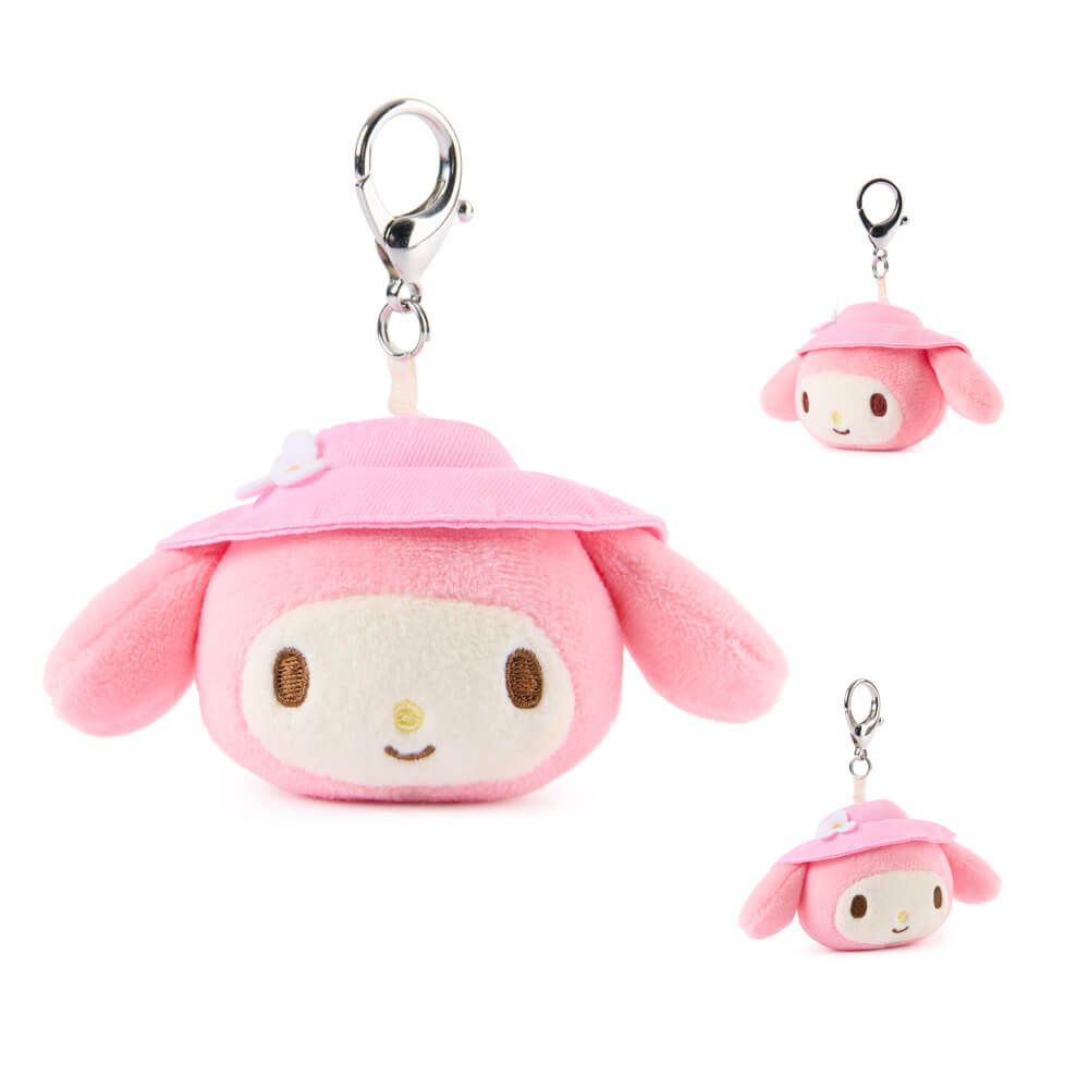 Plush keychain of My Meody wearing a pink hat on a white background