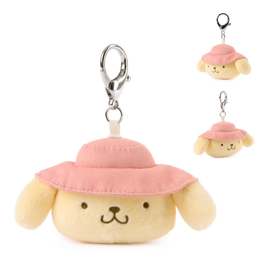 Plush Pompompurin with a pink hat attached to a clip on a white background