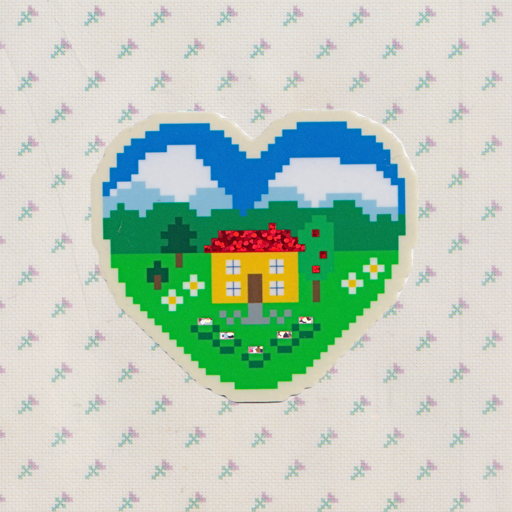 Heart-shaped pixel art design of a house with a garden on a patterned background