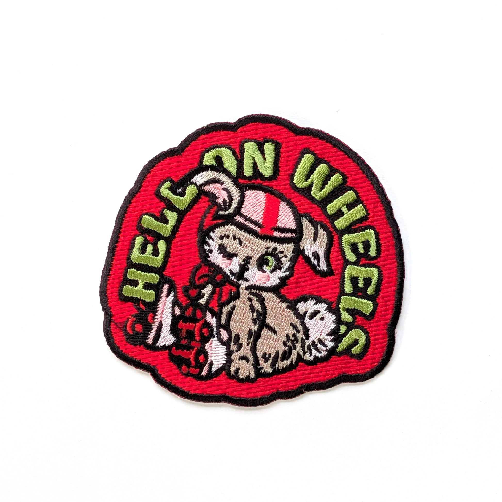 Embroidered patch with a bunny design and 'Hell on Wheels' text on a red background