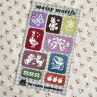 Embroidery pattern with various motifs on a checkered background, featuring the brand &