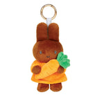 Plush keychain of Melanie holding a carrot on a white background