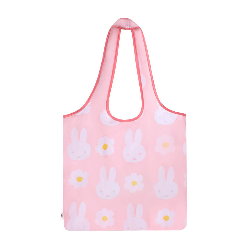 Pink tote bag with miffy and flower design on a white background