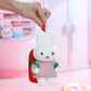 Hand holding a miffy plush keychain