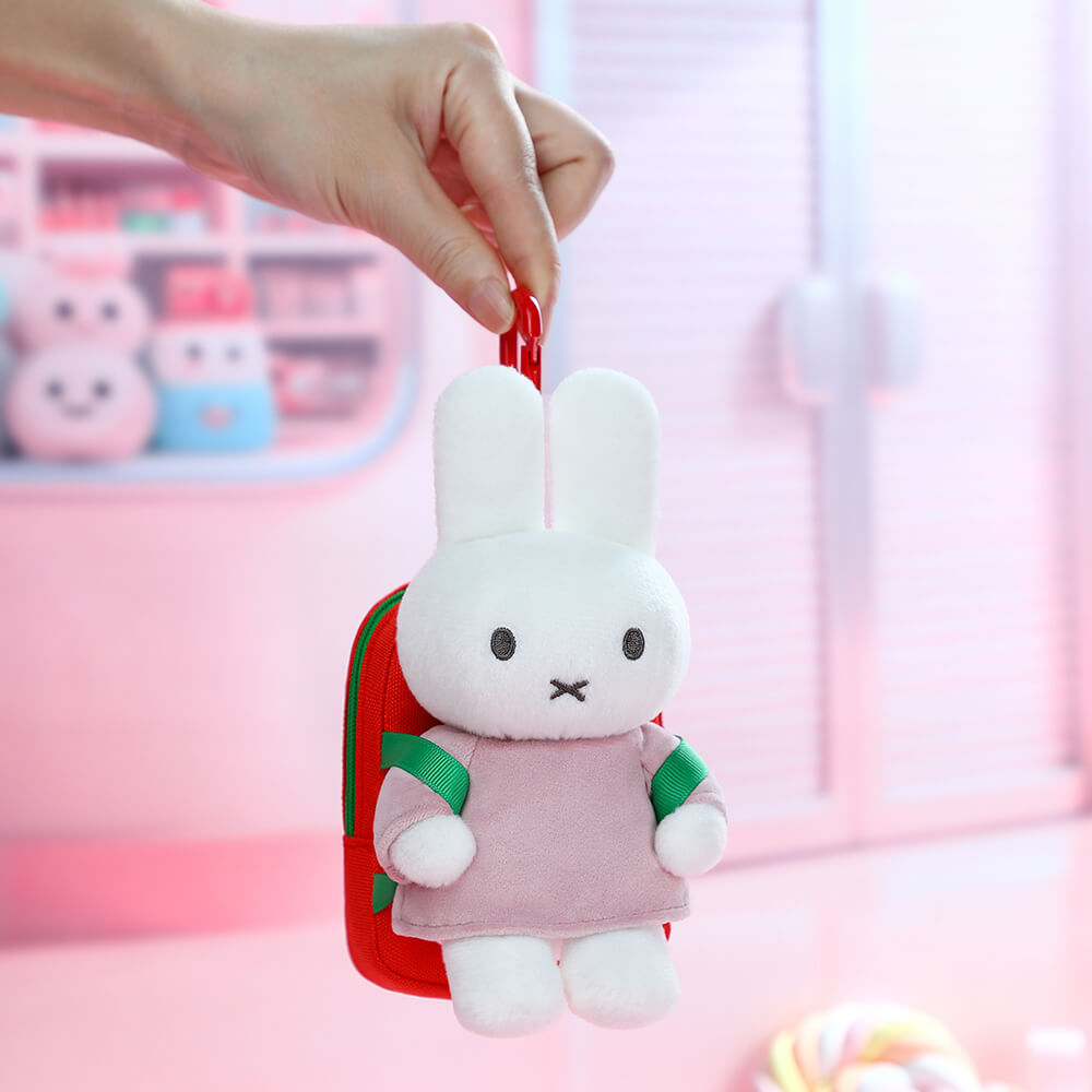 Hand holding a miffy plush keychain