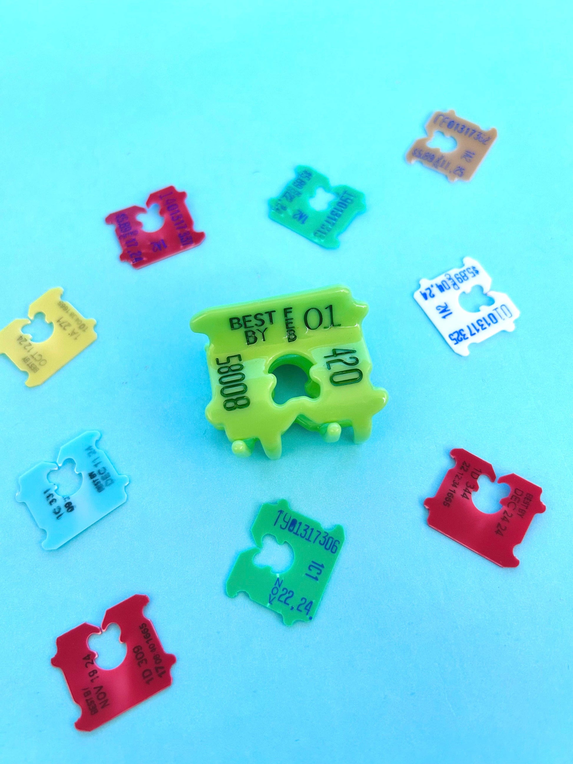 Colorful plastic labels on a blue background