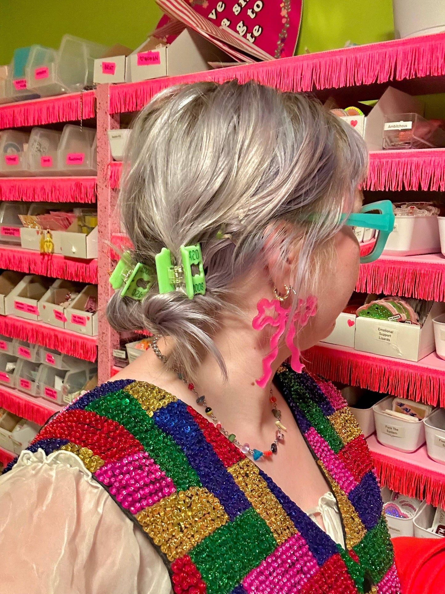 Person with colorful hair clips in a store setting