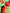 Three perspectives of a person with red and black hair styled with green hair clips on a green background.