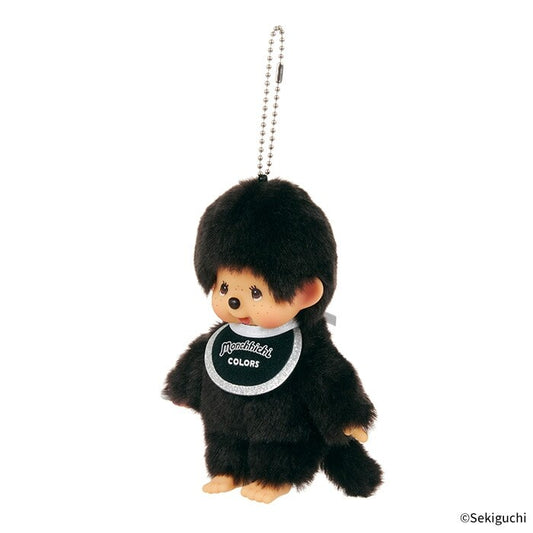 Black Monchhichi plush keychain with a white bib on a white background