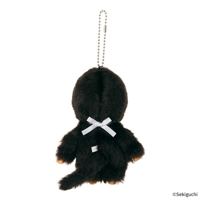 Black Monchhichi plush keychain with a white ribbon on a white background