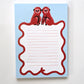A blue notepad with monkey design on a white background