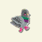 Colorful pigeon-shaped sticker on a beige background