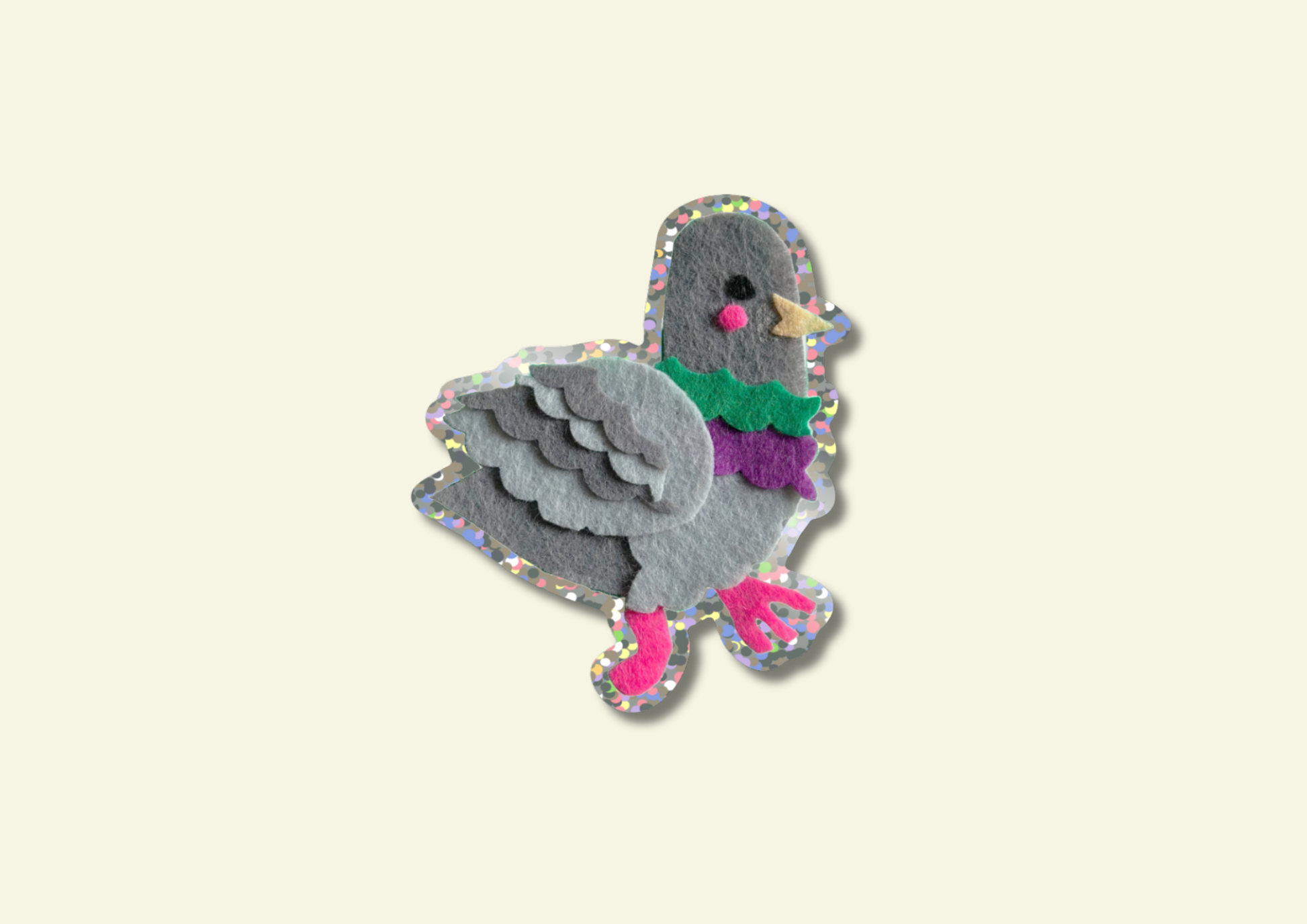 Colorful pigeon-shaped sticker on a beige background