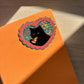 pizza cat glitter sticker on an orange background