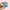 Sticker with cartoon character and text 'Professional Email Recipient' held by a hand with pink nail polish on a pink background.