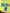 Three colorful stickers on a green surface