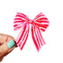 Large red and pink striped bow with glitter on a white background