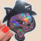 Holographic cat sticker held by a hand with red nail polish on a beige background