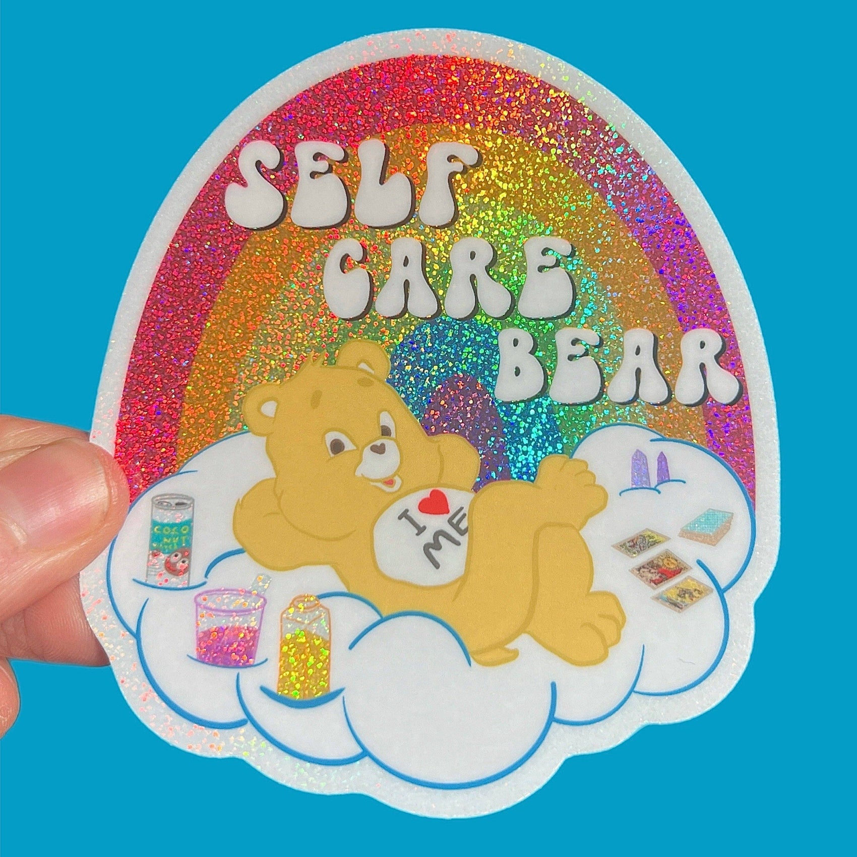 Sticker with a bear character and 'Self Care Bear' text on a blue background