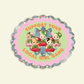 Circular sticker with cartoon characters and text 'Support your local girl gang' on a light pink background