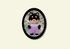 Small dog figurine in a decorative frame on a beige background